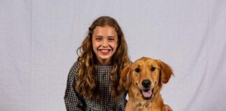 Michelle Stein as Annie and Tucker MacFarlane as Sandy the dog in Prince William Little Theatre's production of 'Annie.' Photo by David Harback.