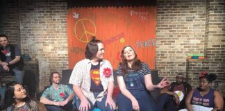 Stephanie Blakely (Anna Maria) sits with Ryan Walker (Jesus) during the song “Day by Day"' Photo by Maureen Hagerman.